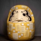 Kristine Aono, Daruma of Resilience, 2019 - 2021, Photocopied documents, paper sticky notes, paint, Aqua Resin, EPS foam, wood base. 84 x 49 x 48 (includes pedestal, not pictured). Courtesy of the artist